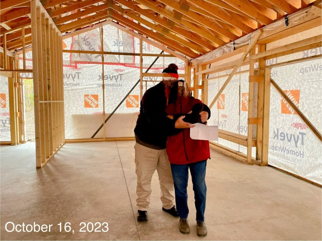 paul and tobey in their home after its framing and zip up for the 2024 winter