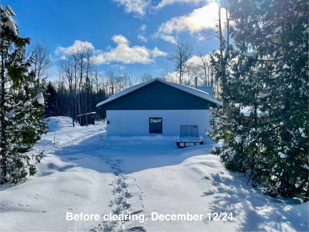 snow covered dip to house