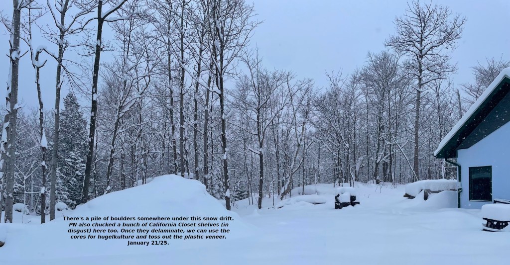 there is a man-sized pile of boulders under the snow
