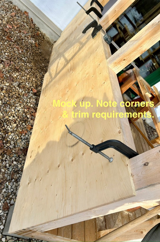 The panels are clamped together to illustrate how they'll be added to the outbuilding.