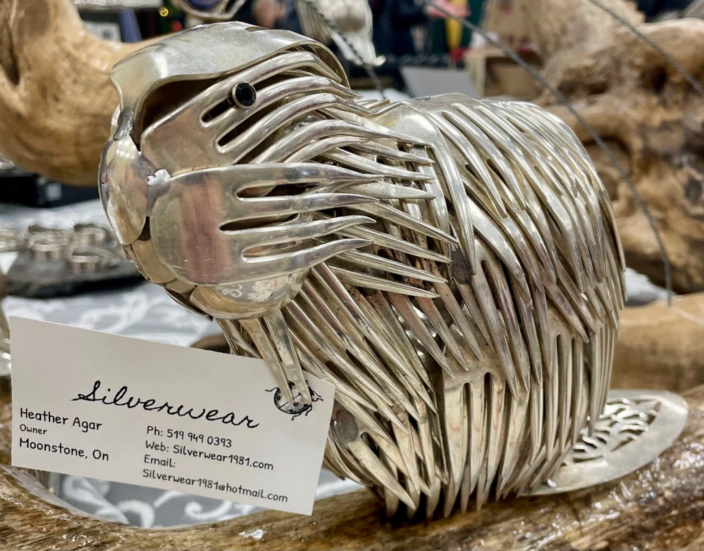 A beaver made out of sterling silver alloy forks. They've been welded together into an artpiece.