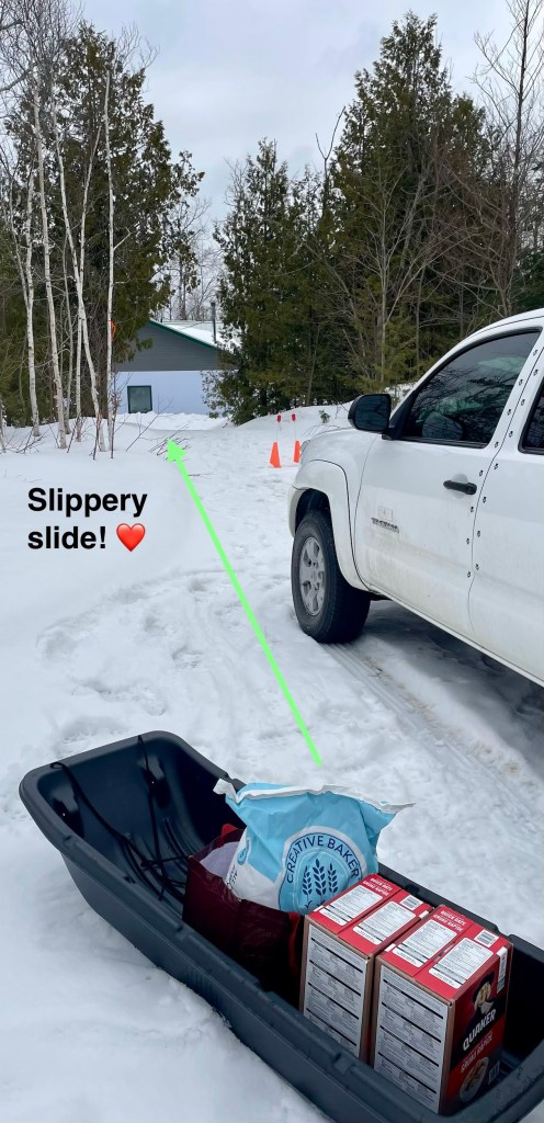 Flour and oats in a sled and it's going to be moved to the farmhouse.