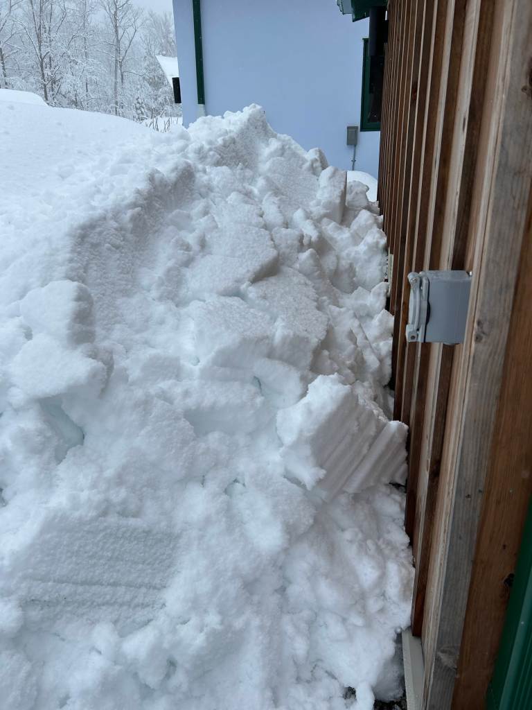All the fucking snow slid off the e-shed's crown.