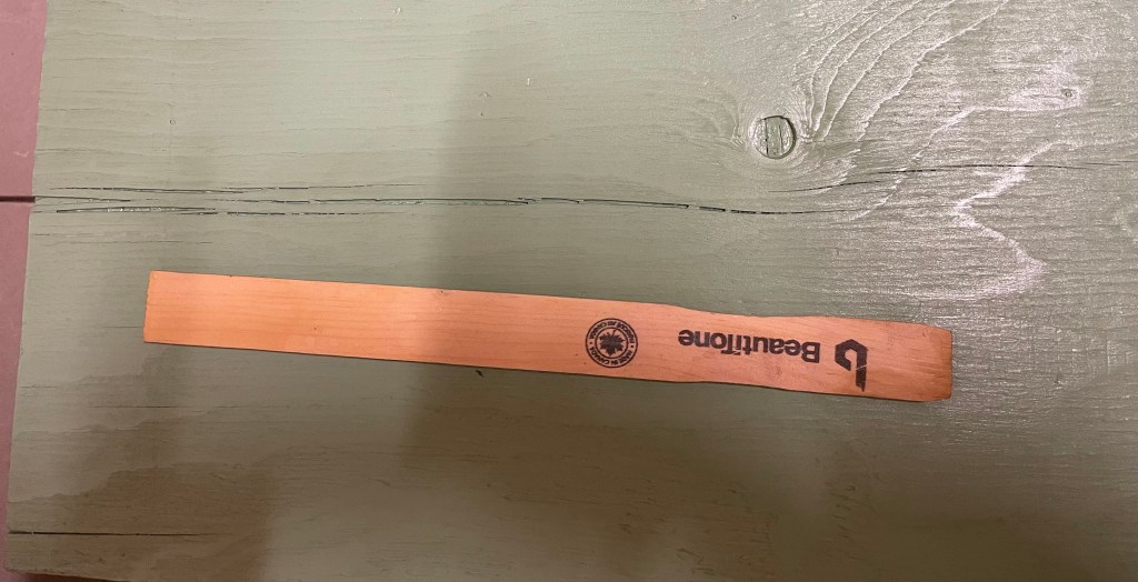 used a paint stick to show the crack's scale