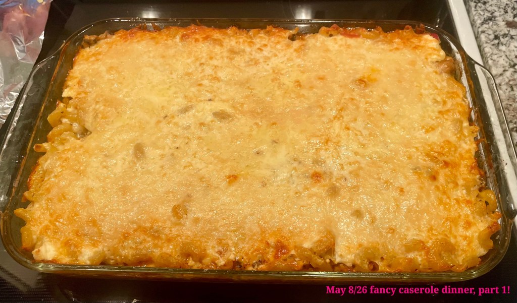 A meaty and cheesy casserole piping hot from the oven.
