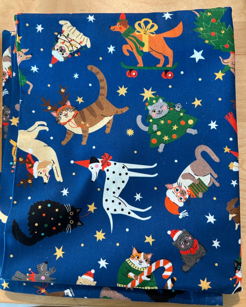 Raw material for making catnip mouse toys. Blue background with dogs and cats.