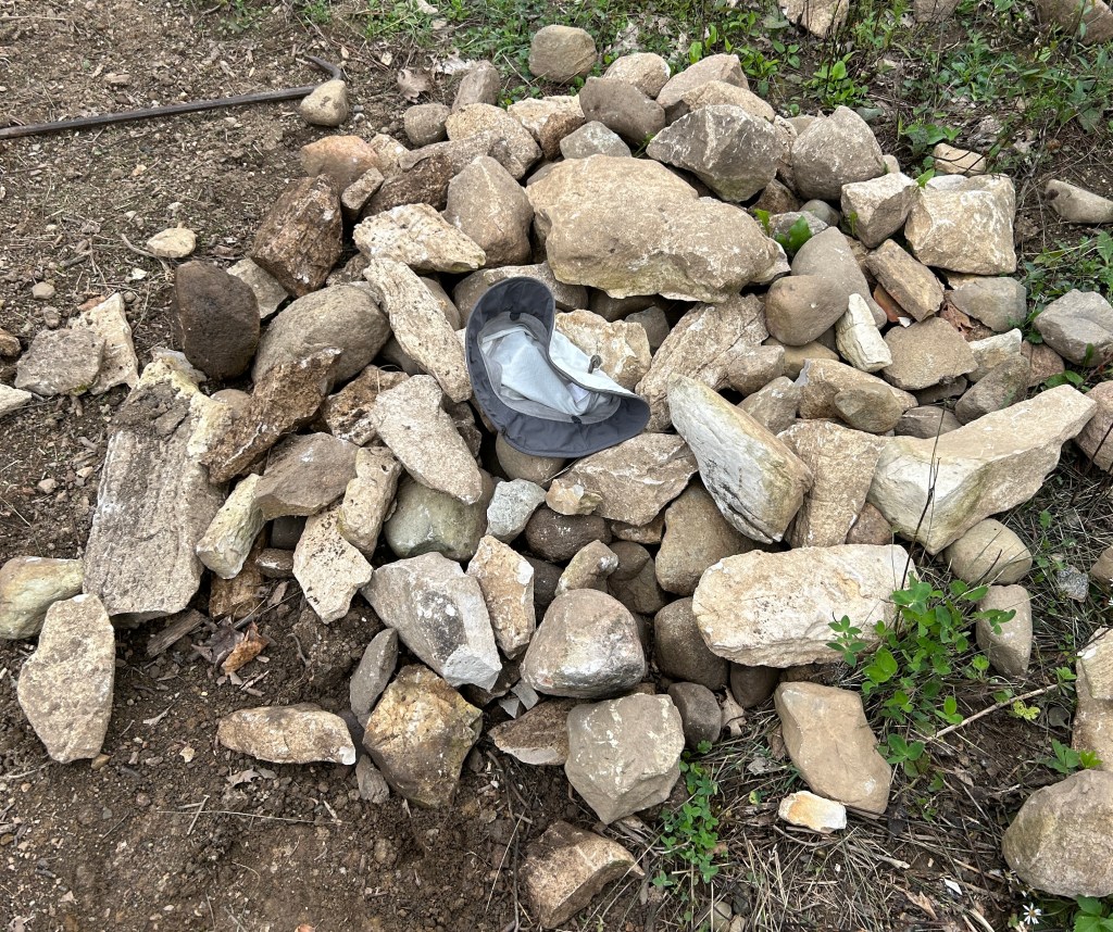 A collection of rocks from the septic system's topsoil. They are not supposed to be there.